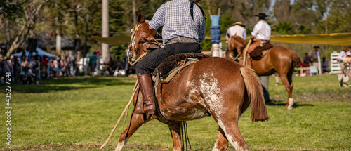 Sport of Argentine culture. Dressage of horses. Typical clothing of the gauchos. Gaucho culture. Entre Ríos, Argentina.