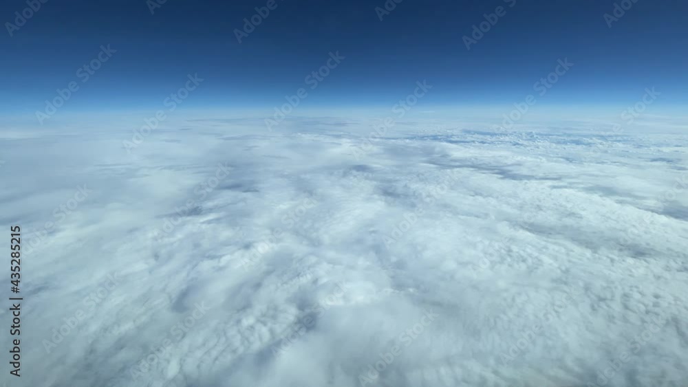 Flying over clouds on a bright day