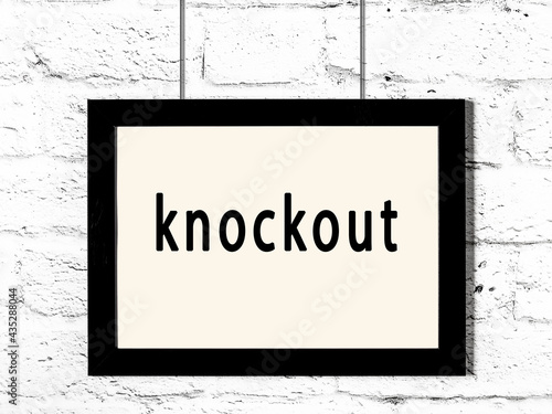 Canvastavla Black frame hanging on white brick wall with inscription knockout
