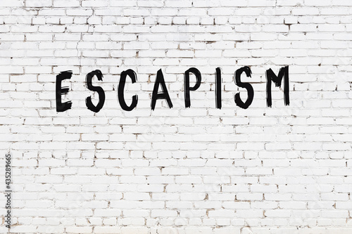 Принти на полотні Inscription escapism painted on white brick wall