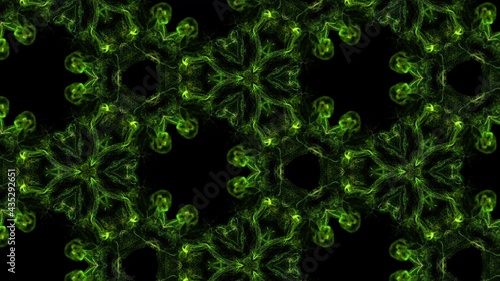 Ink kaleidoscopic effect of glow green particles on black background. Advection like ink effect.
