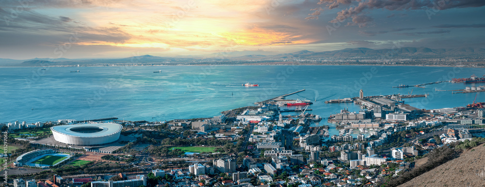 Naklejka premium Beautiful Panoramic vibrant sunset view of Cape Town stadium, Green Point and the Waterfront - Great outdoors adventure and travel holiday destination, Cape Town, South Africa