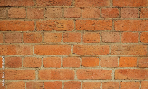 Simple hand made brick wall. Detailed photo of brickwork.