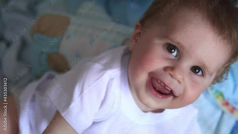 4k portrait of cute little baby boy smiling. baby on bed 4k portrait of cute little baby boy smiling. baby on bed