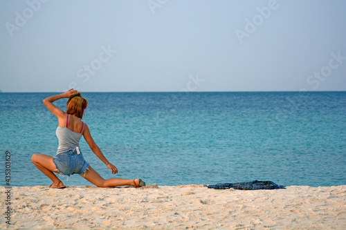 Silhouette woman yoga on the beach
