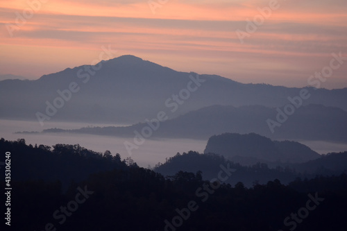 mountains hill range under mist and fog