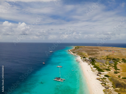 Small Curacao Island famous for day trips and snorkeling tours on the white beaches and blue clear ocean, Klein Curacao Island in the Caribbean sea.  photo