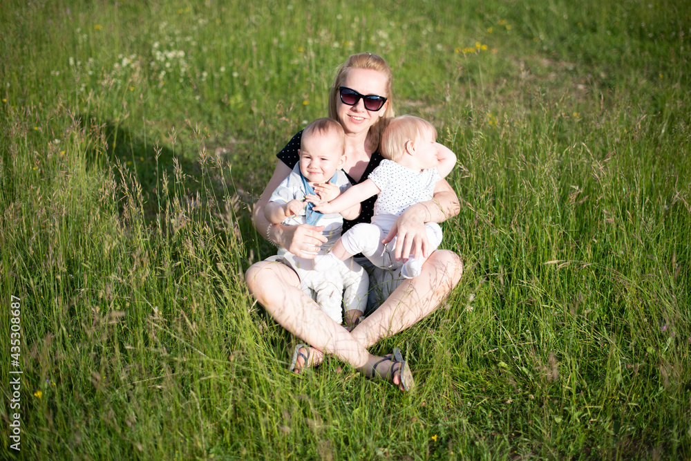Happy Single Mother With Twin in Nature Park Happy Single Mother With Twin in Nature Park