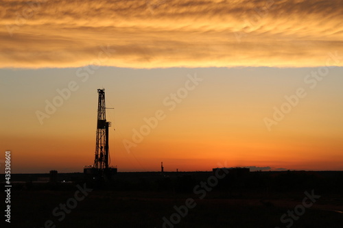 Sunset going over a drilling rig in the Permian Basin of West Texas