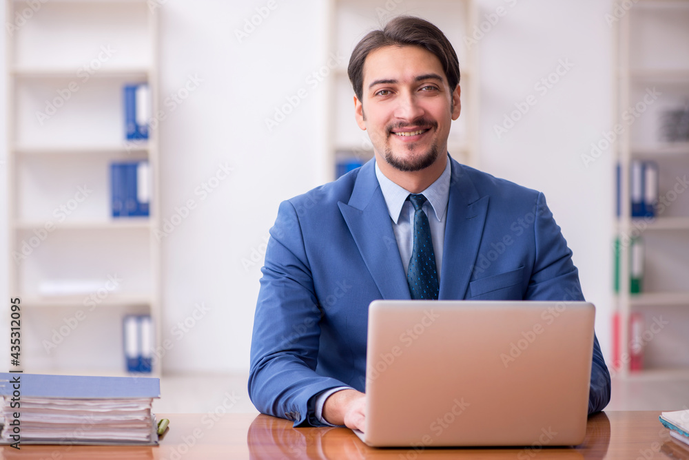 Young businessman employee working in the office Young businessman employee working in the office