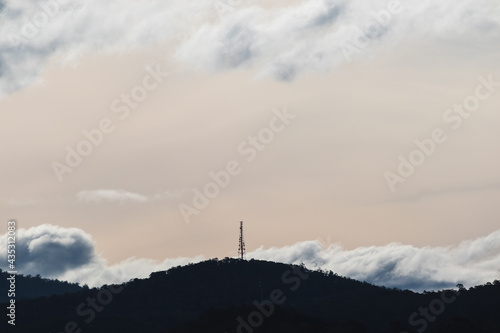 beautiful sky with clouds rolling over the mountains in Tasmania, Australia