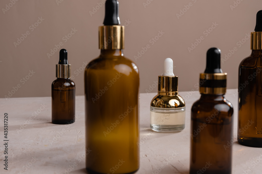 Eco Mineral oil in Amber glass bottles with pipette. Transparent hyaluronic serum gel and skin care concept. Top horizontal view copyspace of dropper glass. Eco Mineral oil in Amber glass bottles with pipette. Transparent hyaluronic serum gel and skin care concept. Top horizontal view copyspace of dropper glass.