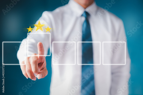 Business people use the index finger to touch the virtual screen to select the starred icons, future digital technology working in digital form, business strategy concepts, human business concepts.