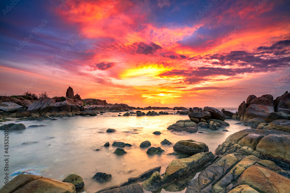 Beautiful sunrise on the beach below the waves lapping at the shore of the soft great to welcome the peaceful new day Beautiful sunrise on the beach below the waves lapping at the shore of the soft great to welcome the peaceful new day