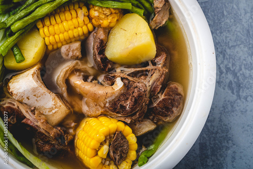 Bulalo- is a beef dish from the Philippines. It is a light colored soup that is made by cooking beef shanks and bone marrow until the collagen and fat has melted into the clear broth.