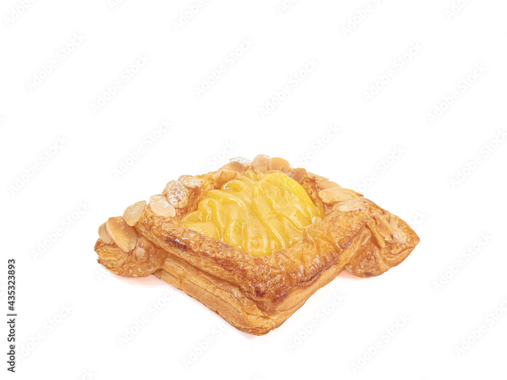 Danish pastry, a close up of homemade delicious sweet cream danish with sliced lemon and almond isolated on white background. Danish pastry, a close up of homemade delicious sweet cream danish with sliced lemon and almond isolated on white background.