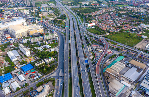 Aerial top view of transportation with Expressway, Road and Roundabout, multilevel junction traffic highway-Top view. Important infrastructure and transport in big city, Bangkok Thailand. photo