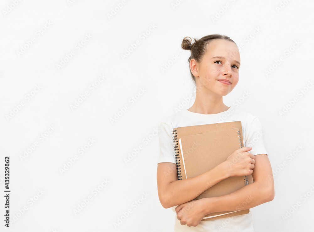 Girl with textbook on the white background Girl with textbook on the white background