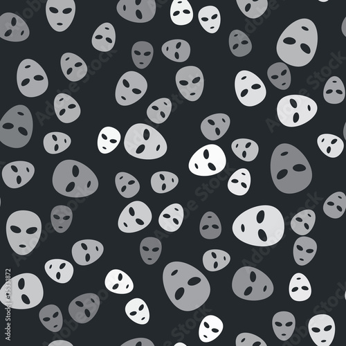 Grey Alien icon isolated seamless pattern on black background. Extraterrestrial alien face or head symbol. Vector
