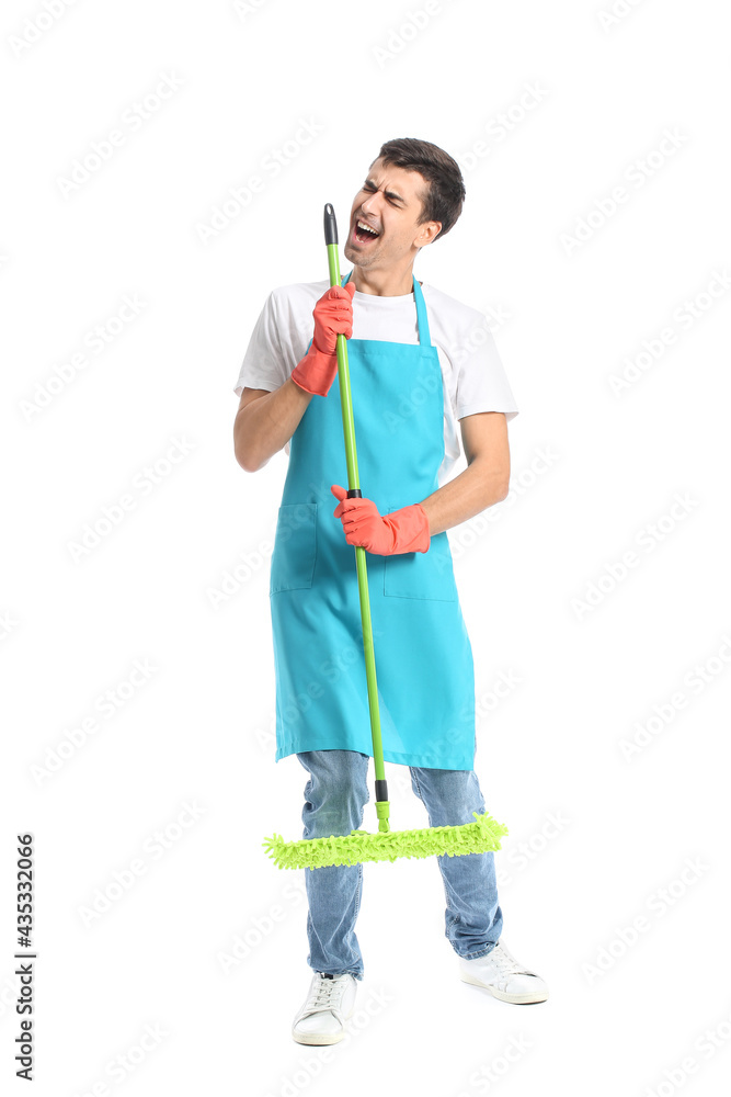 Young man with floor mop singing on white background Young man with floor mop singing on white background