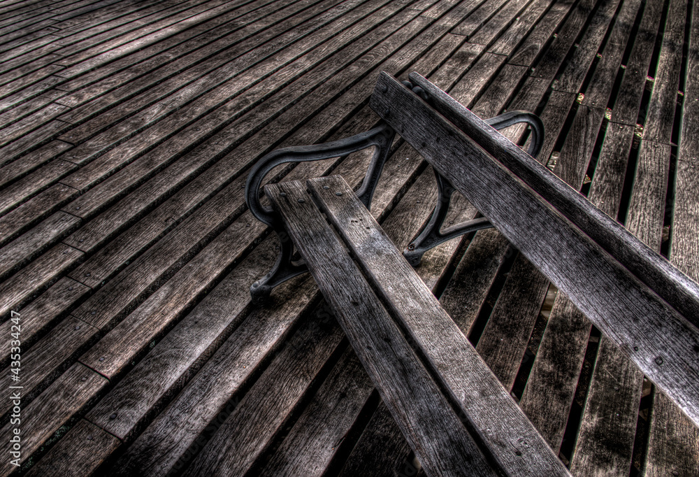HDR rustic bench on wooden floor with beautiful texture. Colonia del Sacramento, Uruguay.