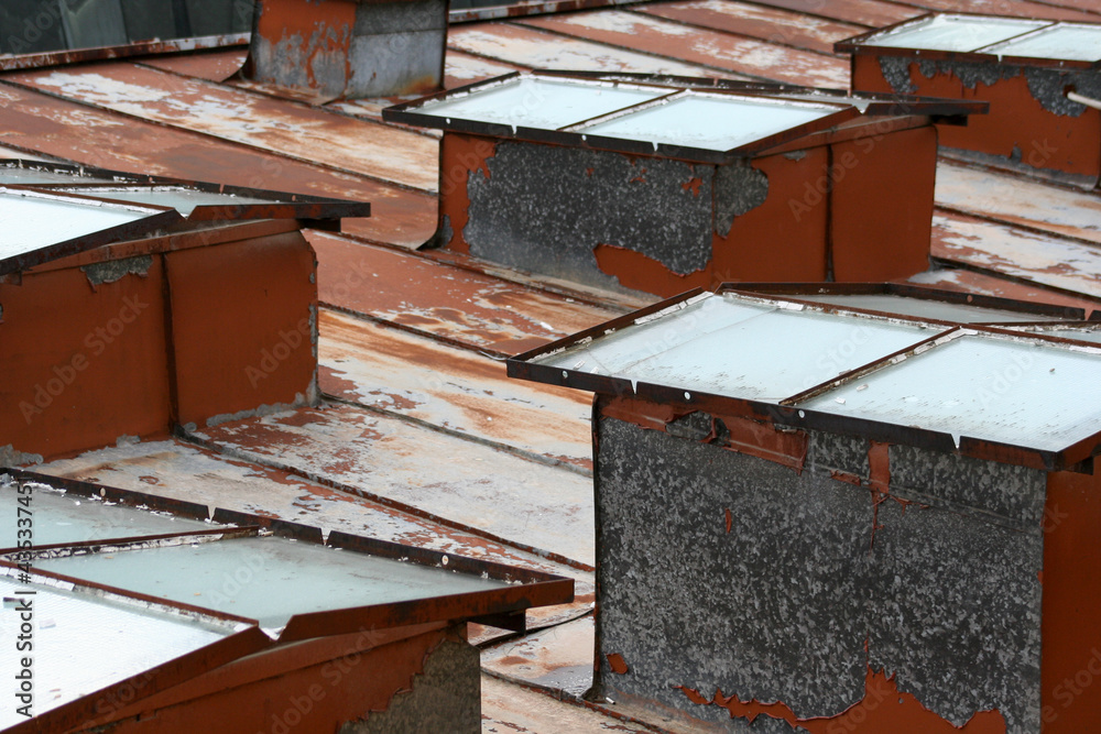 rusty tin roof with skylights on