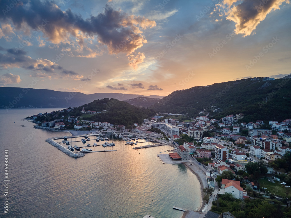 Aerial panoramic view of the Bay of Kotor, Herceg Novi, Montenegro, with the mountains at sunset