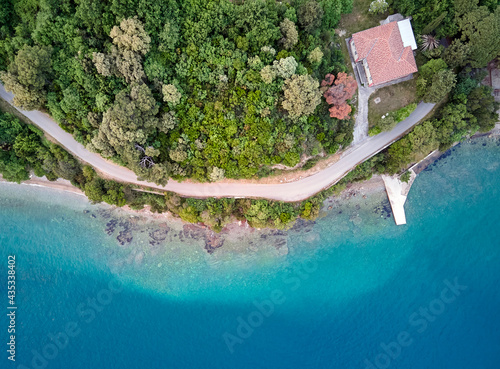 Top view of house with red roofs near the sea photo