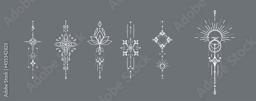 Modern outline bohemian decoration set with symbols of lotus flower, stars, moon, crescents, ray sparkles, sunburst, and stars. Vertical vector isolated ornament design elements 
