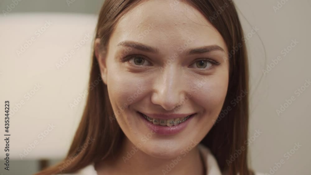 White woman smiling and looking at the camera. White woman smiling and looking at the camera.