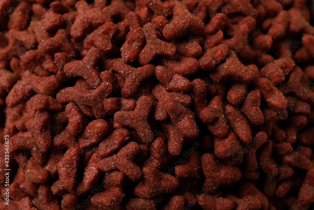 Red pet feed on whole background, close up Red pet feed on whole background, close up