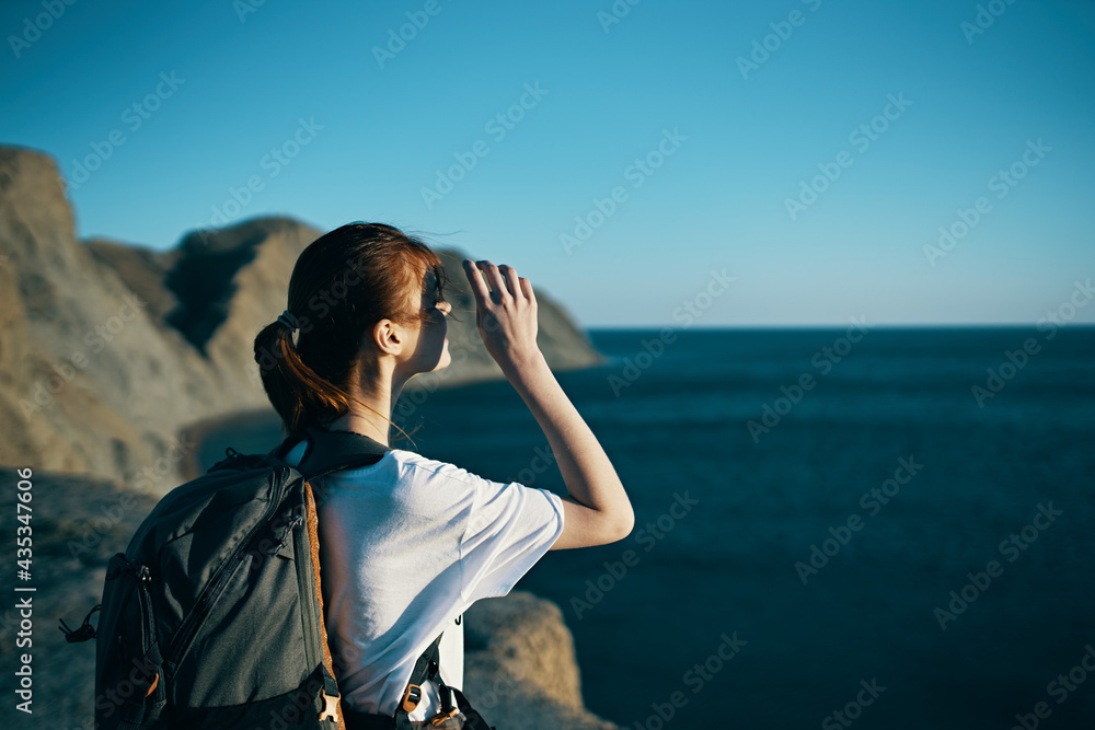 traveler near the sea in nature with a backpack traveler near the sea in nature with a backpack