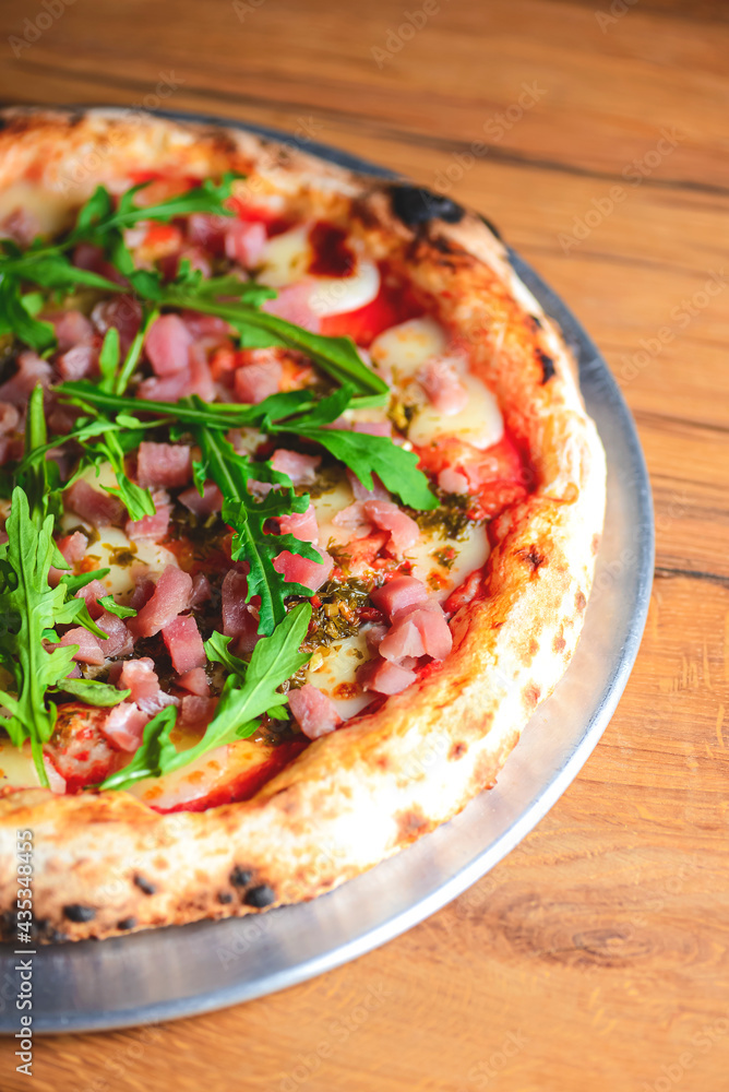 Pizza with seafood and arugula over rustic wooden background. Italian cuisine concept, Italian food. Pizza with seafood and arugula over rustic wooden background. Italian cuisine concept, Italian food.