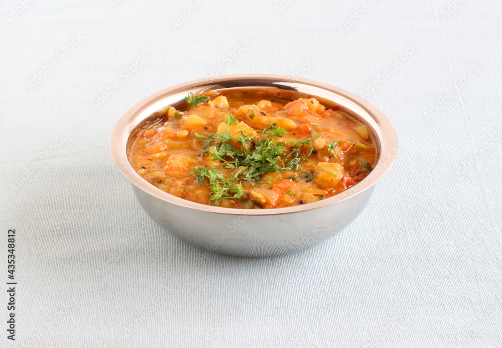 Indian, delicious vegetarian side dish made from potatoes, tomatoes, and onions for food like vermicelli idli, rice idli, rava idli, chapati, and roti. Indian, delicious vegetarian side dish made from potatoes, tomatoes, and onions for food like vermicelli idli, rice idli, rava idli, chapati, and roti.