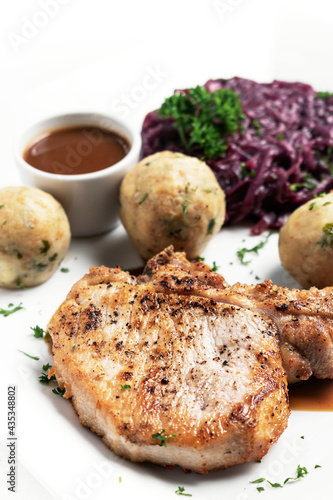 german style grilled pork chop with bread dumplings traditional meal