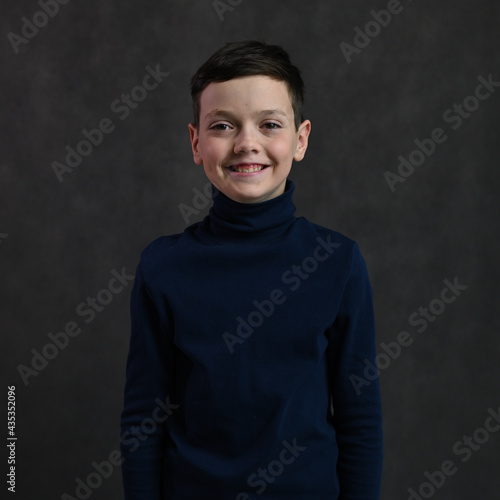 portrait of a cheerful caucasian guy on a gray background