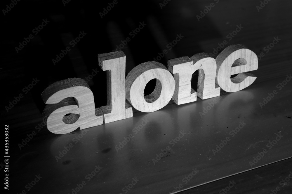 Alone, text words typography written with wooden letter on black background,  life and business negativity Stock Photo | Adobe Stock