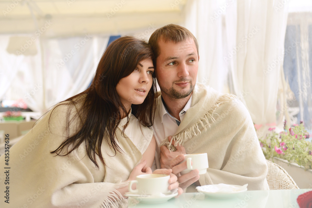 Portrait of a young loving couple in white clothes. Portrait of a young loving couple in white clothes.