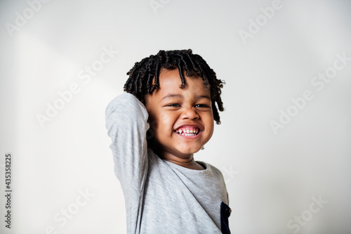 Portriat of young cheerful black boy photo