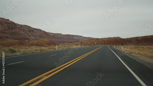 Road trip to Grand Canyon, Arizona USA, driving auto from Utah. Route 89. Hitchhiking traveling in America, local journey, wild west calm atmosphere of indian lands. Highway view thru car windshield.