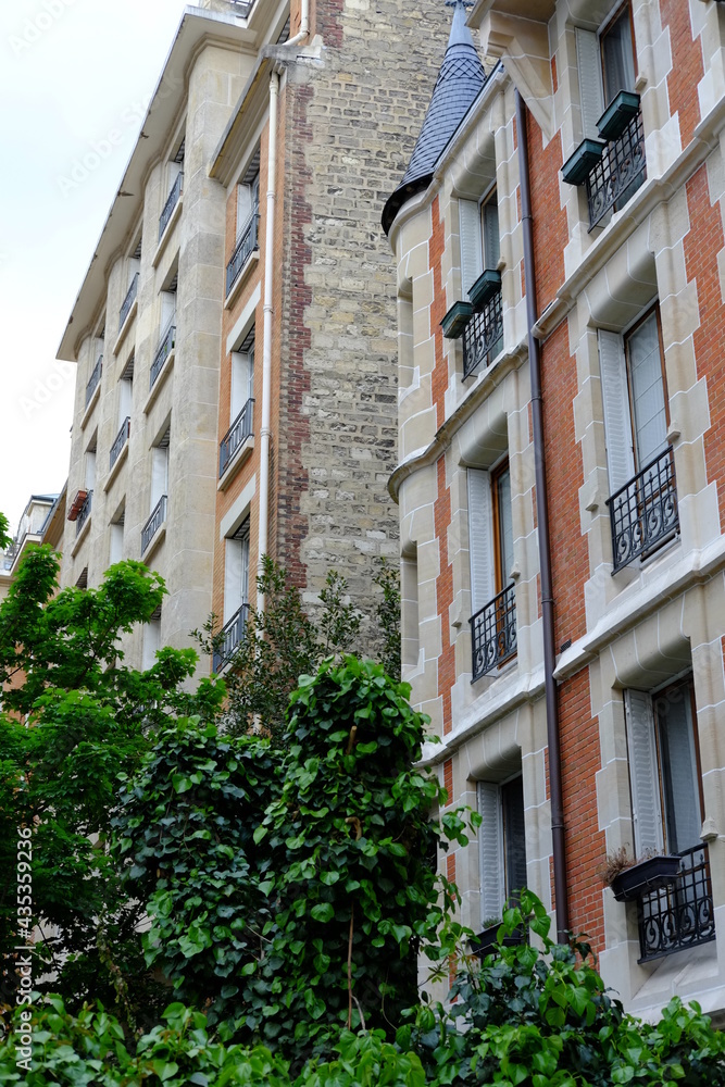 The facade of some Parisian building. May 2021, France. The facade of some Parisian building. May 2021, France.