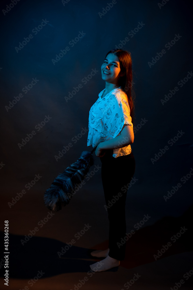Girl in a shirt with pipidustre illuminated by complementary light Girl in a shirt with pipidustre illuminated by complementary light