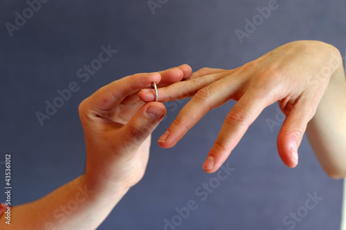 she puts her wedding ring on her finger