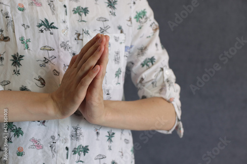 women's hands in the om prayer