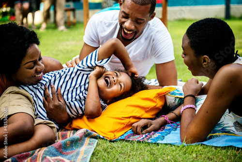 Black family enjoying summer together in the backyard. © Rawpixel.com