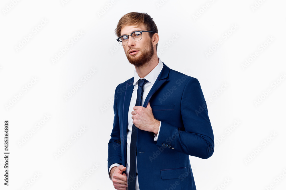 sexy businessman in a classic suit with a tie around his neck and glasses on his face white background sexy businessman in a classic suit with a tie around his neck and glasses on his face white background