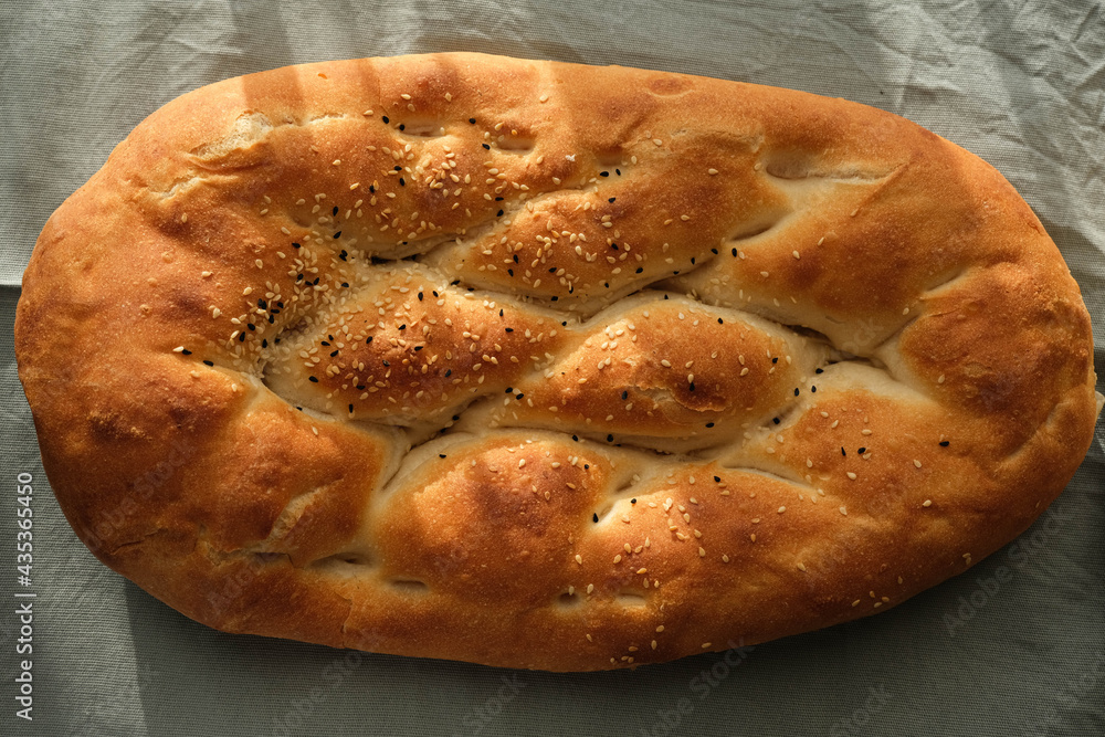 Close-up sesame and black cumin ramadan pita Close-up sesame and black cumin ramadan pita