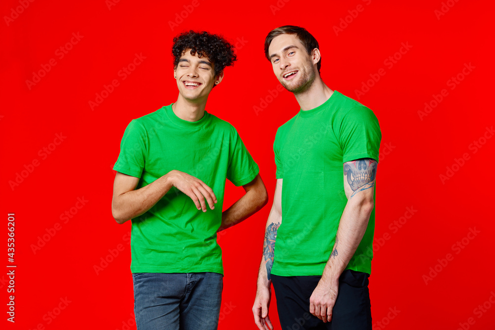 Fototapeta premium two friends cover their hand face emotions displeasure red background