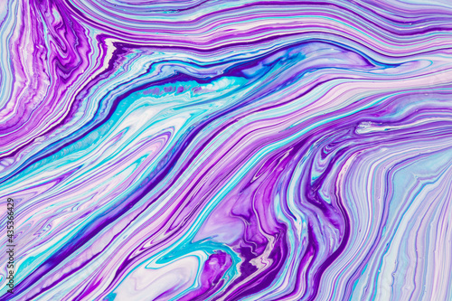 Fluid art texture. Backdrop with abstract swirling paint effect. Liquid acrylic picture with flows and splashes. Mixed paints for posters or wallpapers. Purple, turquoise and blue overflowing colors.