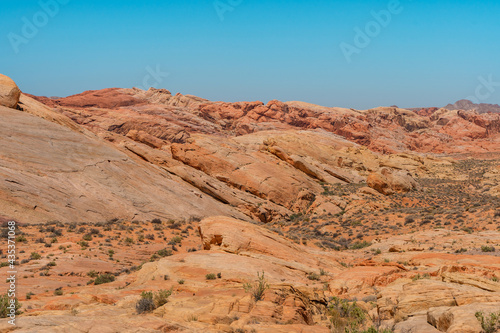 Valley of Fire National Park in Nevada. Orange amazing landscape  stones of different shapes and a fire wave
